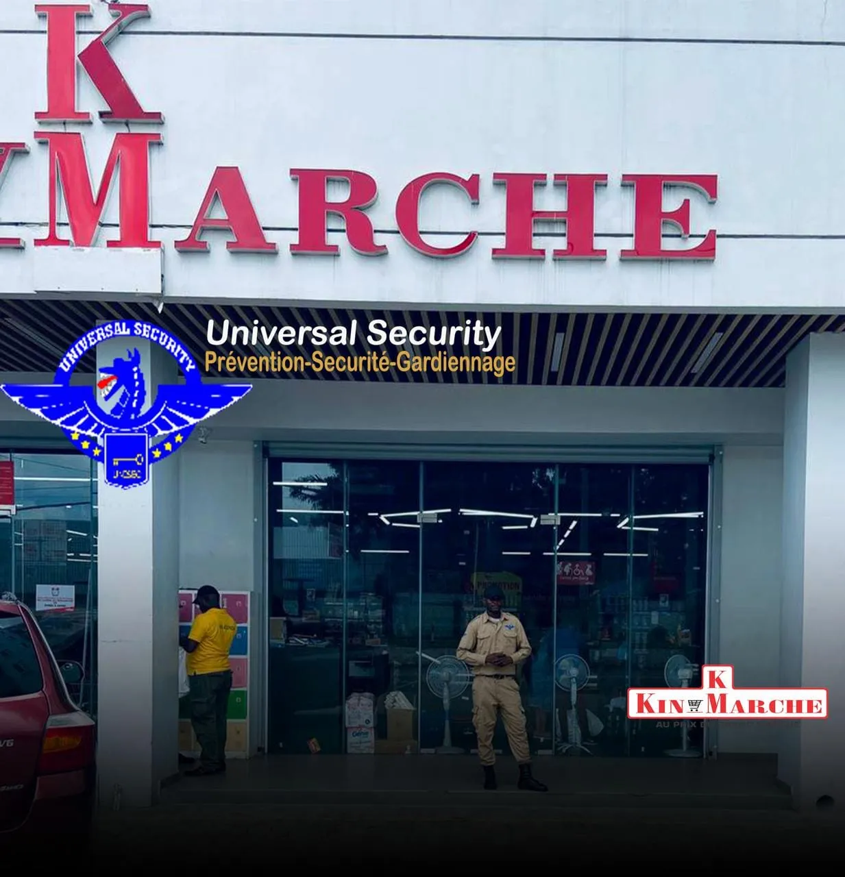Agent Universal Security en faction devant le supermarché Kin Marché à Kinshasa